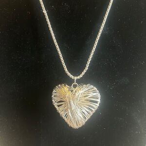 Handcrafted puffy heart pendant on 24 inch silver tone chain